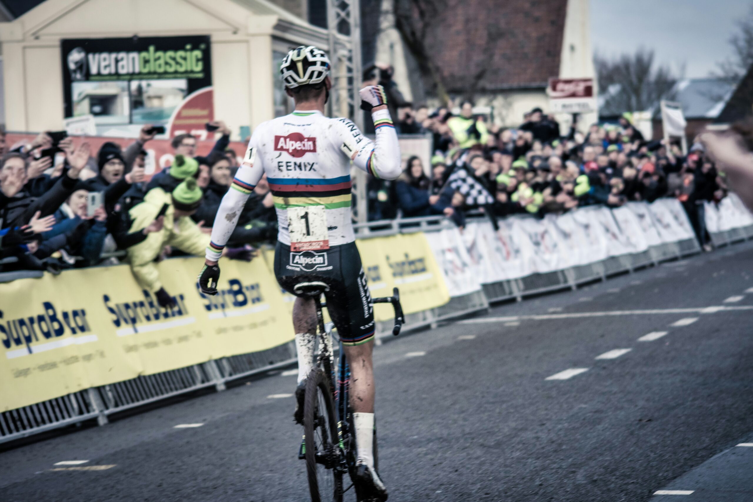 Mathieu van der Poel crossing the finish line as the winner in a cyclocross